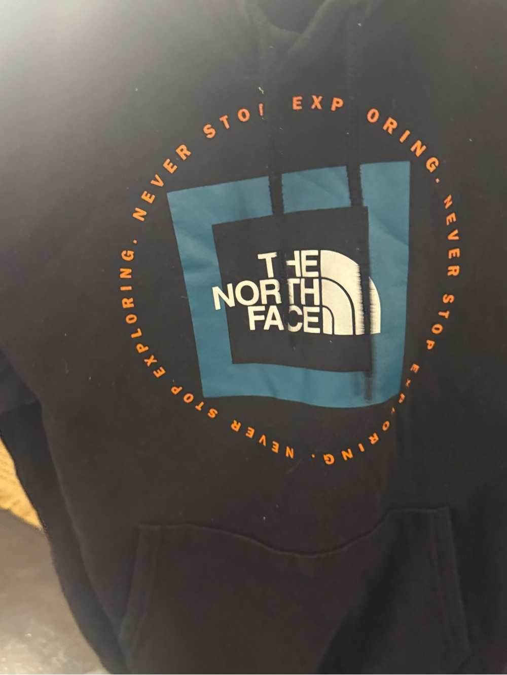 The North Face Men's Black Logo Hoodie with Blue Graphic